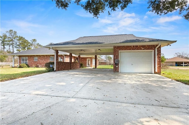 ranch-style house with a carport, a garage, and a front yard