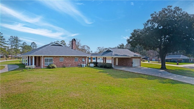 single story home featuring cooling unit, a garage, and a front lawn