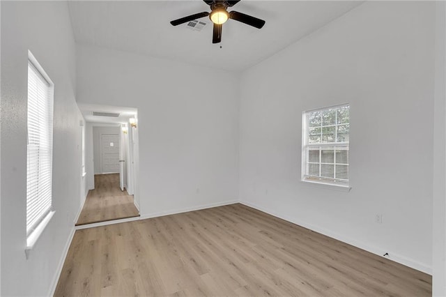 unfurnished room featuring light wood-type flooring and ceiling fan