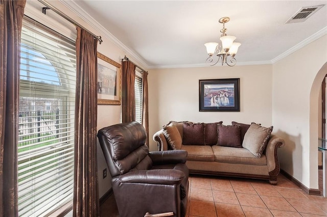 living room featuring a notable chandelier, ornamental molding, and light tile patterned floors