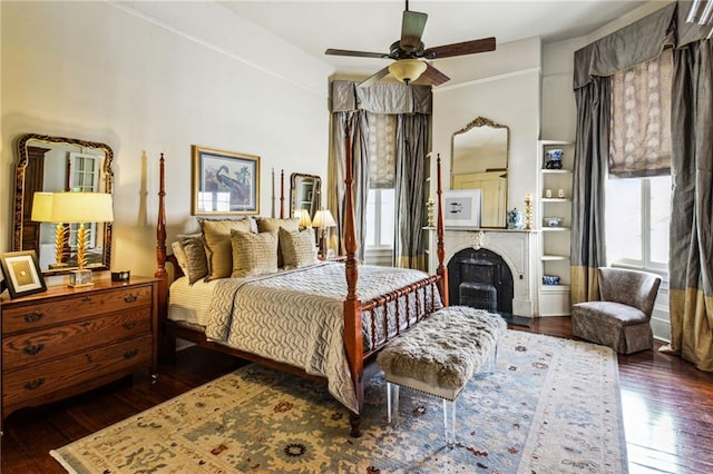 bedroom featuring ceiling fan and dark wood-type flooring