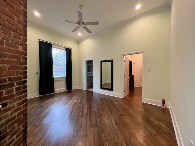 empty room with ceiling fan and dark hardwood / wood-style floors