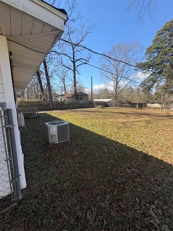 view of yard with central AC