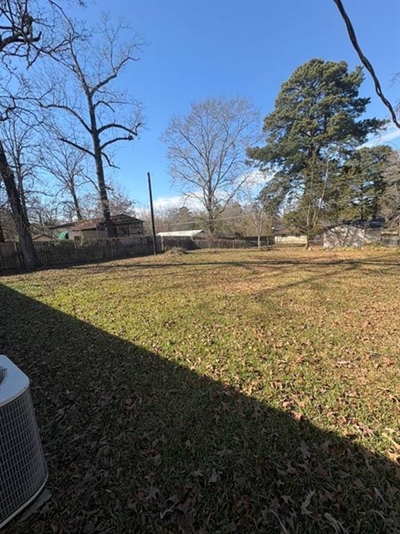 view of yard featuring central air condition unit