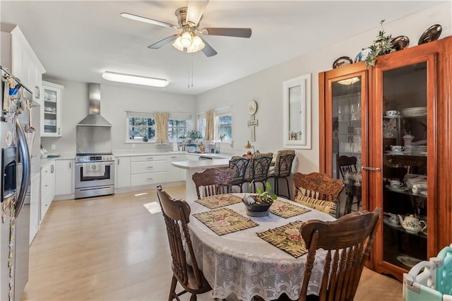 dining room featuring ceiling fan and light hardwood / wood-style floors