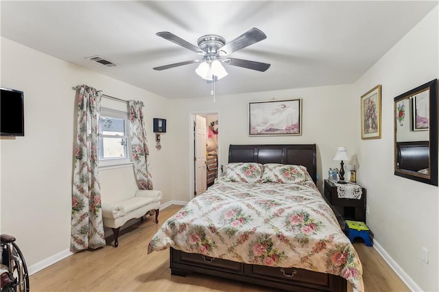 bedroom with light wood-type flooring and ceiling fan