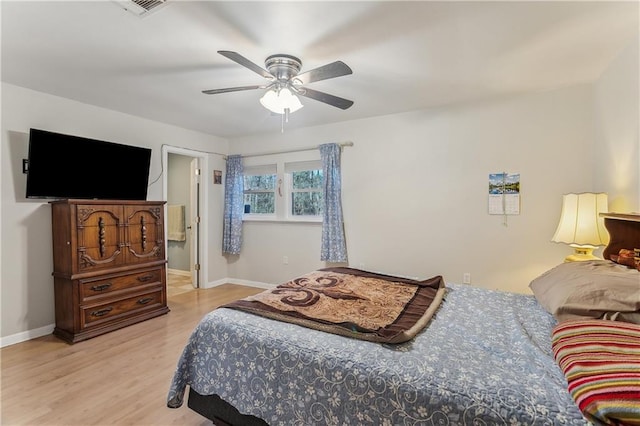 bedroom with light wood-type flooring and ceiling fan