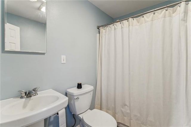 bathroom with sink and toilet