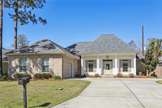 view of front of property with a garage, a porch, and a front lawn