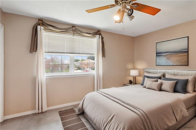 bedroom with carpet flooring, baseboards, and ceiling fan