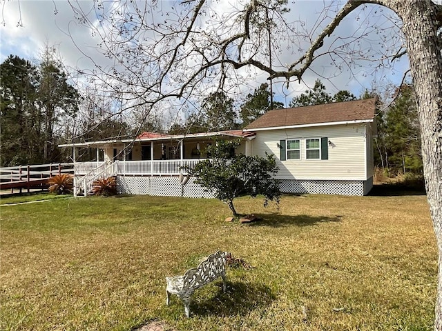 57428 Mainegra Rd, Slidell, LA 70460 - view of front of home with fence and a front lawn