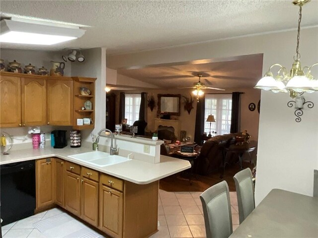 57428 Mainegra Rd, Slidell, LA 70460 - kitchen with light countertops, a peninsula, a sink, and dishwasher