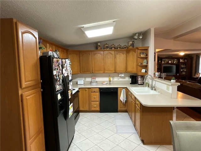 57428 Mainegra Rd, Slidell, LA 70460 - kitchen with a sink, a peninsula, open floor plan, vaulted ceiling, and black appliances