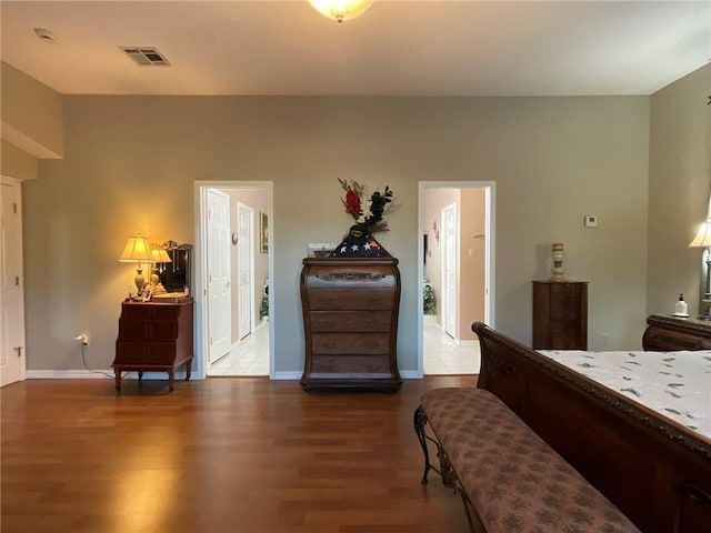 57428 Mainegra Rd, Slidell, LA 70460 - bedroom featuring baseboards, wood finished floors, and visible vents