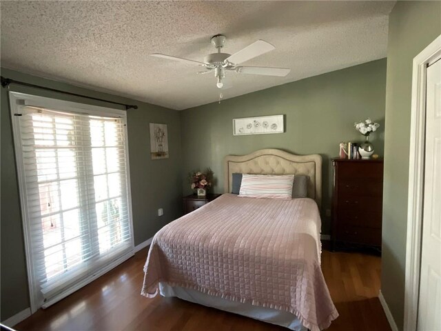 57428 Mainegra Rd, Slidell, LA 70460 - bedroom featuring lofted ceiling, wood finished floors, baseboards, a textured ceiling, and a ceiling fan