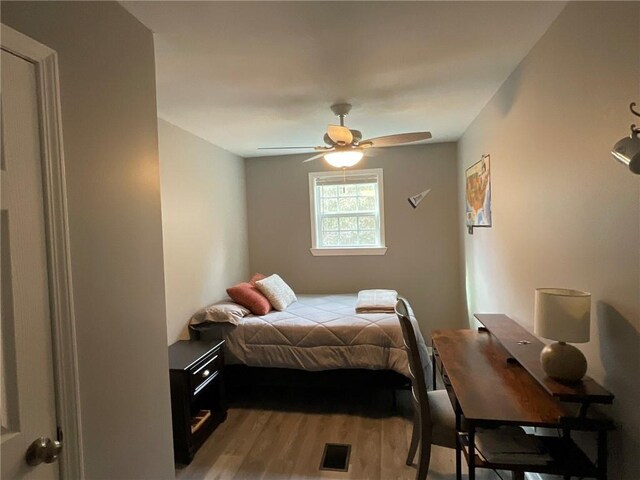 57428 Mainegra Rd, Slidell, LA 70460 - bedroom featuring a ceiling fan, visible vents, and light wood-style floors