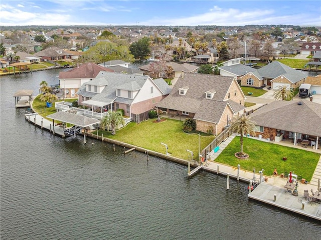 aerial view featuring a residential view and a water view