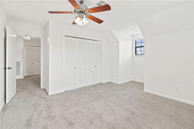 unfurnished bedroom featuring a closet, visible vents, carpet flooring, and baseboards