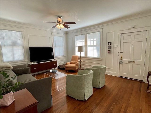 living room with plenty of natural light, ceiling fan, dark hardwood / wood-style floors, and ornamental molding