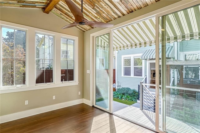 doorway with hardwood / wood-style flooring, plenty of natural light, and lofted ceiling with beams