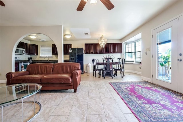 living room with sink and ceiling fan