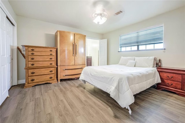 bedroom featuring a closet and light hardwood / wood-style floors