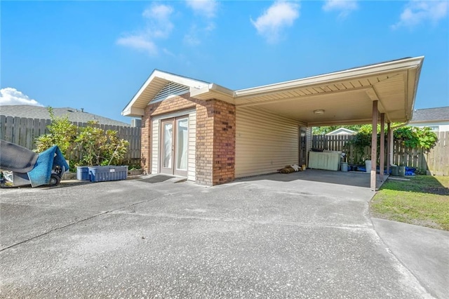 view of property exterior featuring a carport