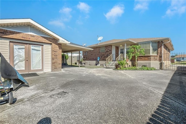 exterior space featuring french doors and a carport