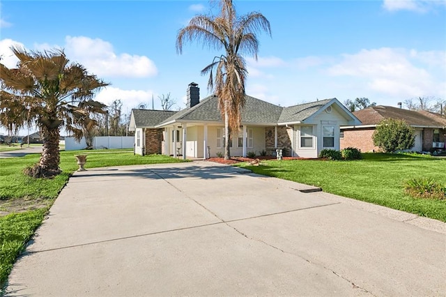 single story home featuring a front yard