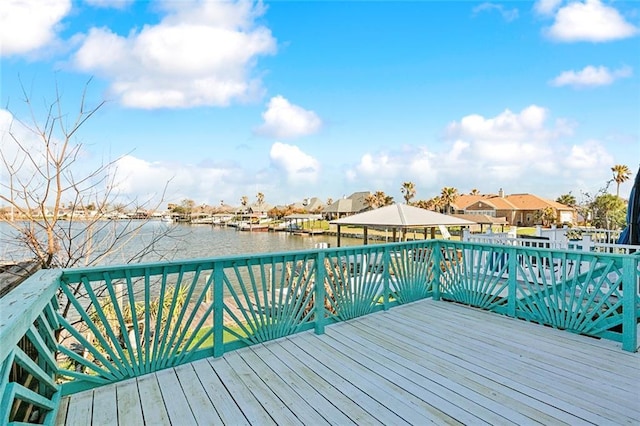 wooden deck with a water view