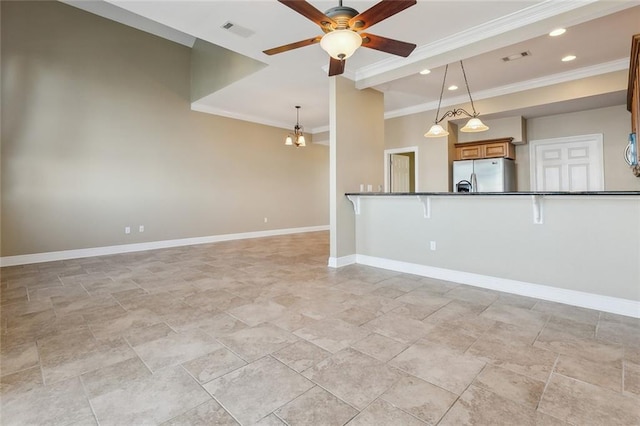 unfurnished living room featuring ceiling fan with notable chandelier and crown molding