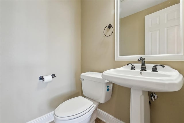 bathroom featuring toilet