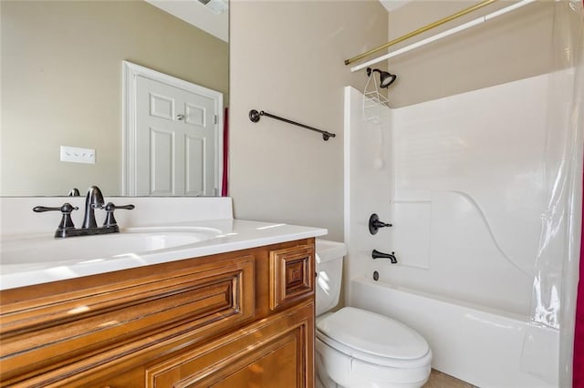 full bathroom with toilet, vanity, and shower / washtub combination