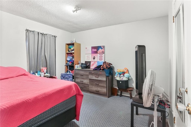 carpeted bedroom with a textured ceiling