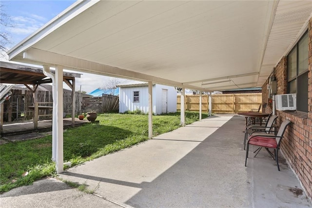 view of patio / terrace featuring a storage shed