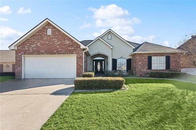 view of front facade with a garage and a front lawn