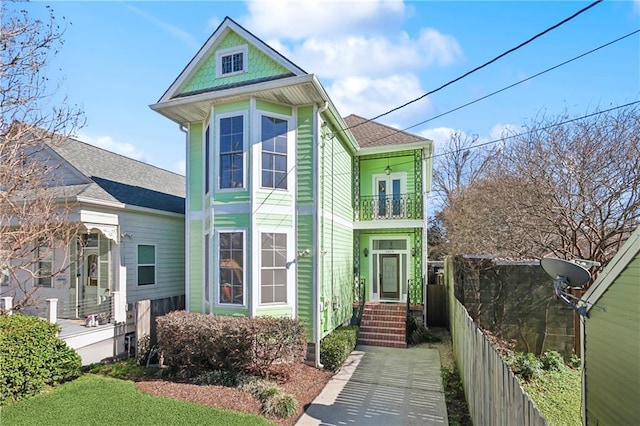 victorian house featuring a balcony