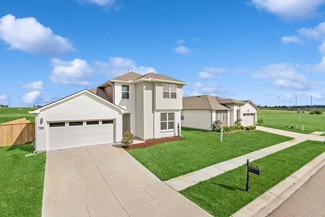 view of property with a front yard and a garage