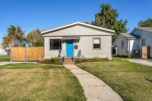 bungalow with a front lawn