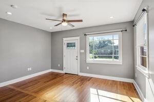 foyer featuring ceiling fan and wood-type flooring