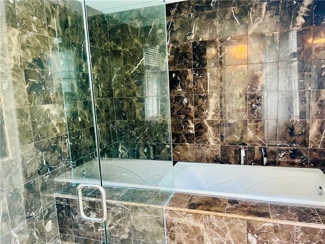 1608 Governor Nicholls St, New Orleans, LA 70116 - full bathroom featuring a bath and a stall shower