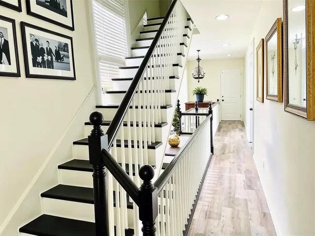 1608 Governor Nicholls St, New Orleans, LA 70116 - stairway with baseboards, recessed lighting, and wood finished floors