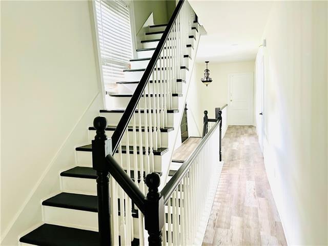 1608 Governor Nicholls St, New Orleans, LA 70116 - stairway featuring wood finished floors