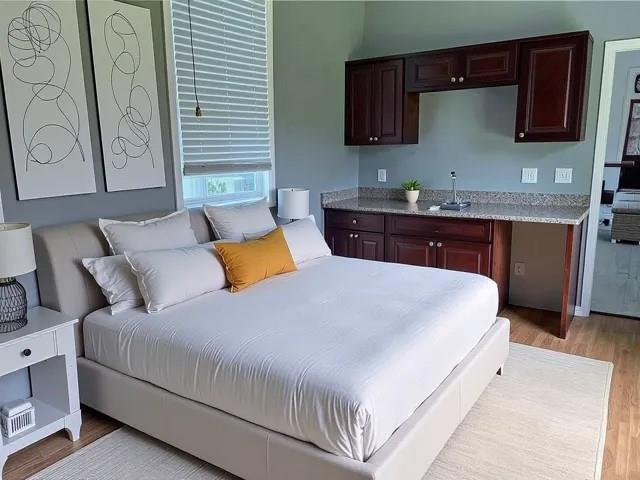1608 Governor Nicholls St, New Orleans, LA 70116 - bedroom with a sink and light wood finished floors