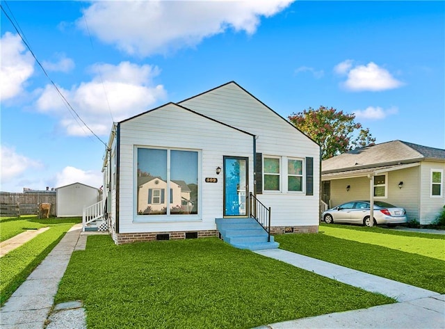 view of front facade with entry steps, a front lawn, crawl space, and fence