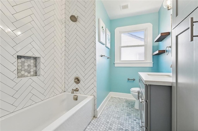 full bathroom featuring toilet, vanity, shower / tub combination, baseboards, and tile patterned floors