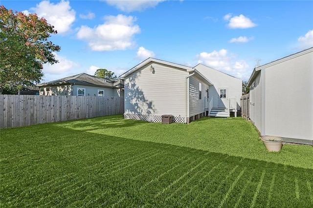 exterior space featuring fence and a yard