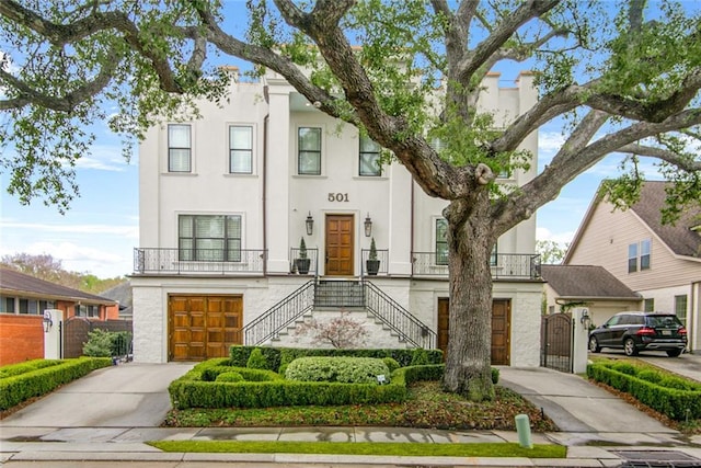501 Emerald St, New Orleans, LA 70124 - view of front of home with fence, an attached garage, stairway, a gate, and concrete driveway