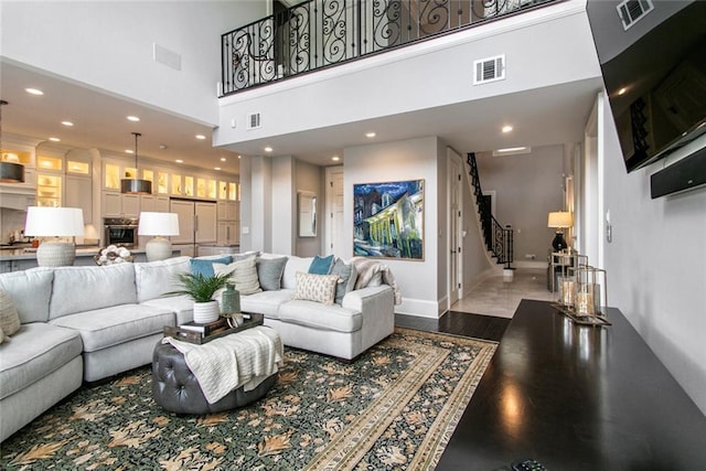 501 Emerald St, New Orleans, LA 70124 - living area featuring recessed lighting, visible vents, and stairway
