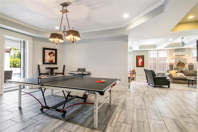501 Emerald St, New Orleans, LA 70124 - rec room featuring an AC wall unit, a tray ceiling, ornamental molding, and a wealth of natural light